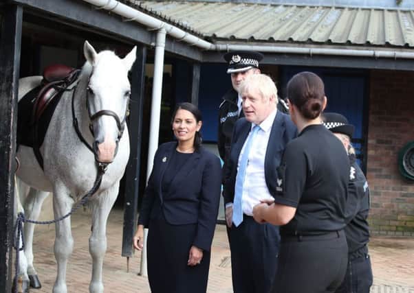 Prime Minister Boris Johnson and Home Secretary Priti Patel during a campaign visit to Wakefield to meet police.