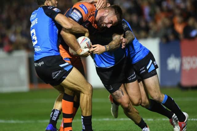 Castleford Tigers' Mike McMeeken takes it to the Hull defence (PIC: JONATHAN GAWTHORPE)