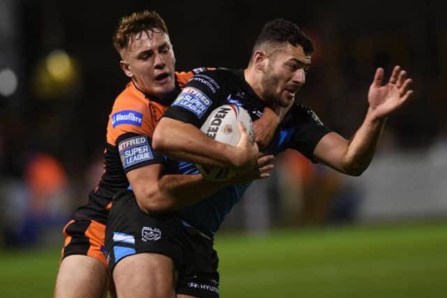 Hull FC's Jake Connor is collated by Castleford's Jake Trueman (PIC:JONATHAN GAWTHORPE)