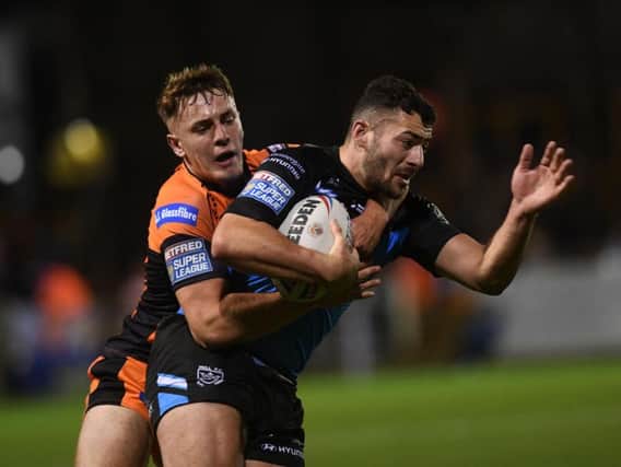 Hull FC's Jake Connor is collated by Castleford's Jake Trueman (PIC:JONATHAN GAWTHORPE)