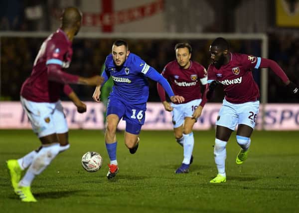 ONE TO WATCH: Dylan Connolly takes on West Ham United in last season's famous FA Cup victory over the Premier League club for AFC Wimbledon. Picture: Ben Stansall/Getty Images)