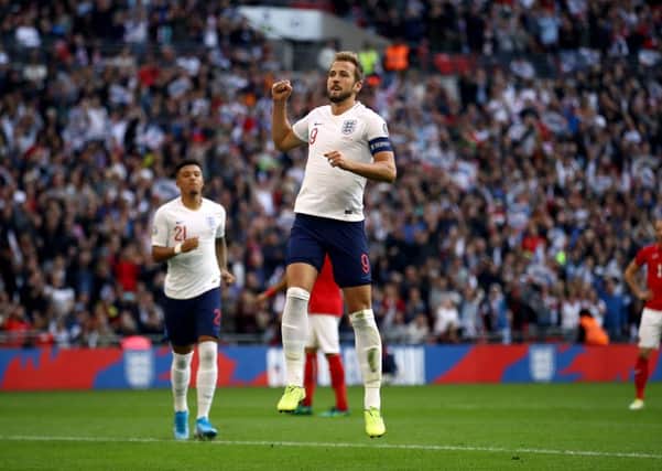 England's Harry Kane celebrates scoring his side's fourth goal of the game from the penalty spot at Wembley. Picture: Tim Goode/PA