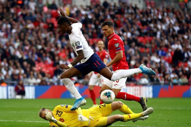 Bulgaria's goalkeeper Plamen Iliev saves at the feet of England's Marcus Rashford at Wembley. Picture: Tim Goode/PA