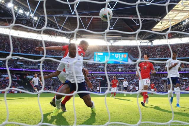England's Raheem Sterling (left) scores his side's third goal of the game at Wembley. Picture: Nick Potts/PA
