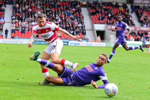 FAMILIAR FACE: Doncaster Rovers' Jon Taylor and Rotherham's Carlton Morris. Picture: Marie Caley.