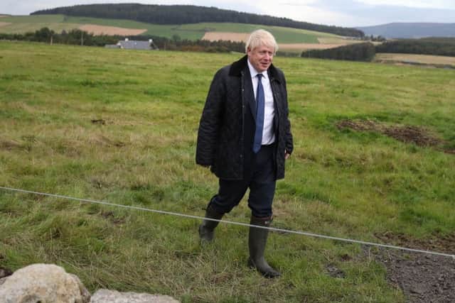 Boris Johnson's pledges to farmers have been overshadowed by Cabinet resignations.