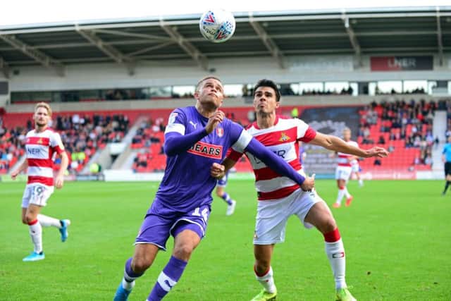 Doncaster's Reece James and Rotherham's Carlton Morris, pictured. Picture: Marie Caley