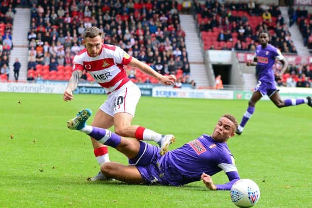 Doncaster's Jon Taylor and Rotherham's Carlton Morris, pictured. Picture: Marie Caley