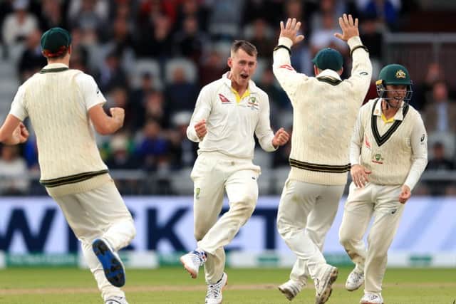Australia's Marnus Labuschagne celebrates the wicket of England's Jack Leach at Old Trafford. Picture: Mike Egerton/PA