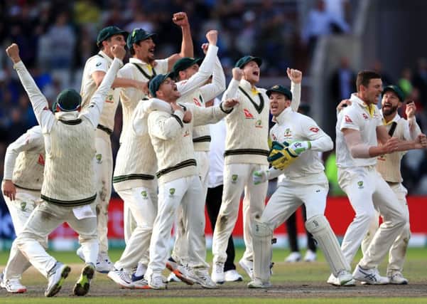 Australia celebrate after they claimed victory to retain the Ashes at Old Trafford. Picture: Mike Egerton/PA