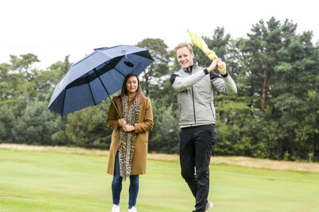 Dan Walker swinging in the rain with Olympic gold medallist Jessica Ennis-Hill. Picture: Dean Atkins Photography