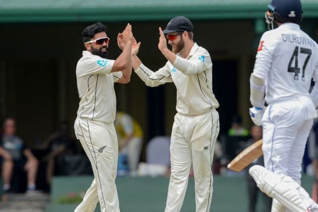New Zealand cricketer Ajaz Patel celebrates a wicket against Sri Lanla last month with captain Kane Williamson. Picture: Lakruwan Wanniarach/Getty Images