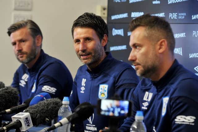 NEW ERA: Huddersfield Town manager Danny Cowley centre, and Nicky Cowley with director of football David Webb, right.  Picture: Tony Johnson