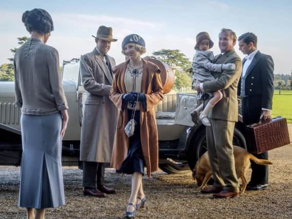 From left, Harry Hadden-Paton, Laura Carmichael, Hugh Bonneville and Michael Fox, right, in a scene from Downton Abbey. (Jaap Buitendijk/Focus Features via AP)