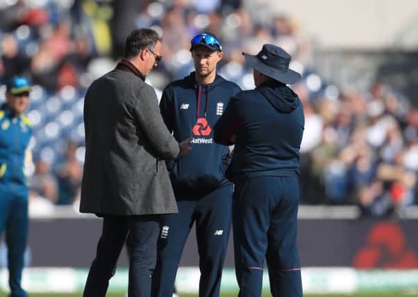 England captain Joe Root (centre), coach Trevor Bayliss (right) and former player Michael Vaughan prior to the start of day five at Old Trafford. Picture: Mike Egerton/PA
