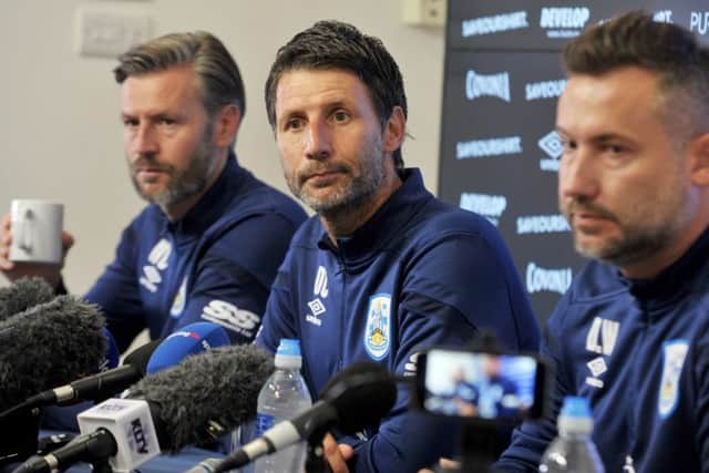 Huddersfield Town's new management team Danny, centre, and Nicky Cowley with director of football operations David Webb. (Picture: Tony Johnson)