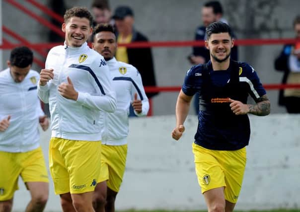 Friends reunited: Leeds United's Kalvin Phillips and Alex Mowatt, now of Barnsley, are all smiles warming up in July 2016. (Picture: Jonathan Gawthorpe)