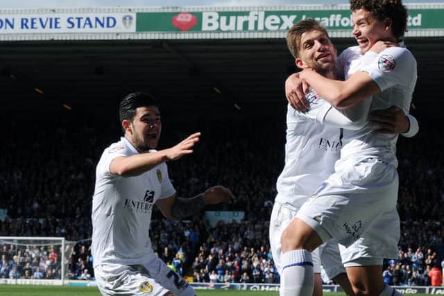 Leeds United's Kalvin Phillips celebrates scoring on his home debut, with Charlie Taylor and Alex Mowatt. April 2015.(Picture: Jonathan Gawthorpe)