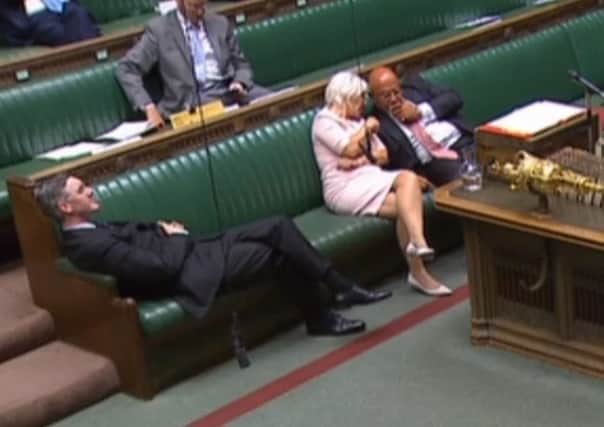 Leader of the House of Commons Jacob Rees-Mogg reclining on his seat in the House of Commons.