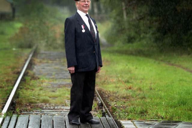 World War Two veteran Norman Jones from Leeds stands at the railway at Groesbeek, Holland in 2008