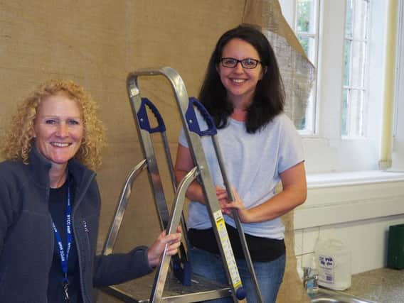 New teachers, Mrs Hunter and Mrs Stephenson, put the finishing touches to the classroom facelift. Photo: Submit