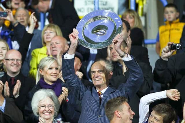 Huddersfield Giants chairman Ken Davy with the League Leaders Shield back in 2013. Picture: Alex Whitehead/SWPix.com