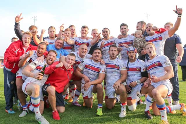 SPARED: Wakefield's players celebrate their Million Pound Game win over Bradford Bulls back in 2015. Picture: Alex Whitehead/SWpix.com