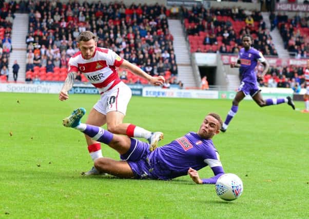 Doncaster Rovers' Jon Taylor battles against his former club, Rotherham last weekend, pictured. Picture: Marie Caley