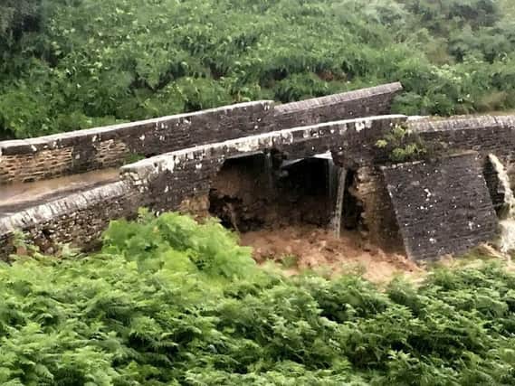 Grinton Bridge collapsed under the force of flooding.  Swaledale MRT / SWNS