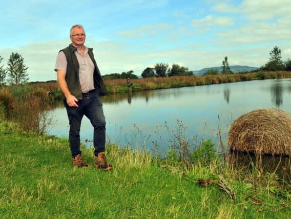 Tom Seymour by the fishing ponds on Dromonby Farm at Kirkby in Cleveland .