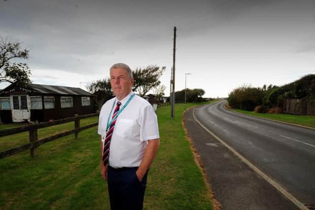 Coun Dave Tucker by Holmpton Road which is under threat from coastal erosion
Picture Simon Hulme
