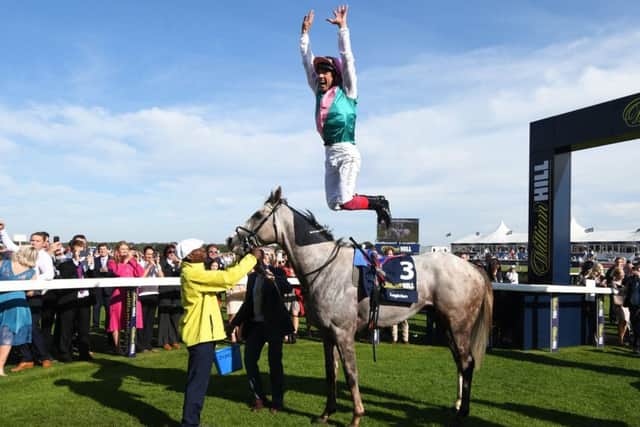 Frankie Dettori performed a flying idsmount after Logician's St Leger win.
