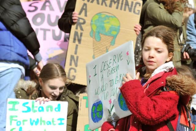 School students with their banners on the Town Hall steps in Leeds at the Youth Strike for Climate strike in March. Image: Gary Longbottom.