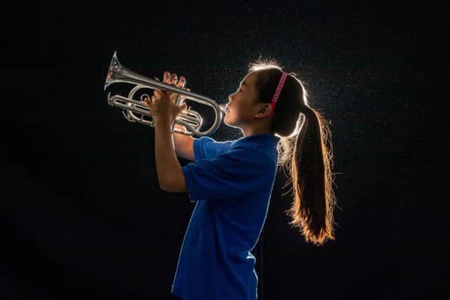 Kirkbymoorside Brass Band, one of the oldest in the country, have just moved into their new hall named the James Holt Concert Hall. Pictured Band member Yanxi Wang, aged 10, from Kirkbymoorside, playing her cornet during the rehearsal. Image: James Hardisty