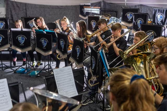 Kirkbymoorside Brass Band conductor Jeanette Kendall, with members rehearsing in the new concert hall. Image: James Hardisty