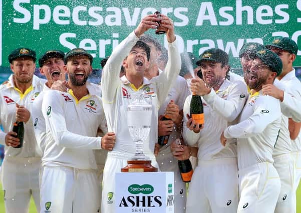Australia players celebrate retaining the Ashes.