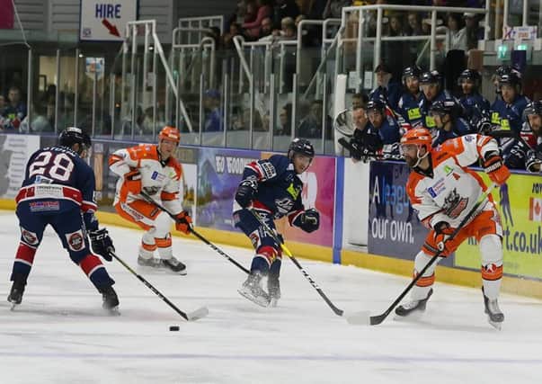 John Armstrong, far right, tries to engineer another offensive move against Dundee Stars, the Canadian scoring two goals on the night. Picture: Derek Black/EIHL.