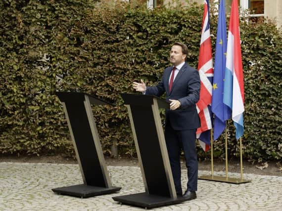 Luxembourg's Prime Minister Xavier Bettel, right, addresses a media conference next to an empty lectern intended for British Prime Minister Boris Johnson after a meeting at the prime ministers office in Luxembourg. Photo: AP Photo/Olivier Matthys