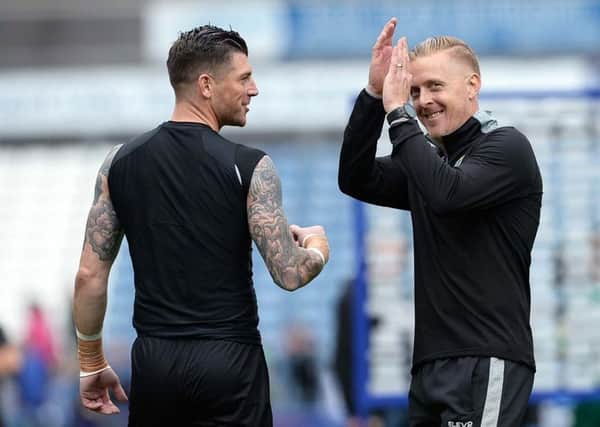 Well done: Manager Garry Monk with goalkeeper Keiren Westwood. Picture: Steve Ellis