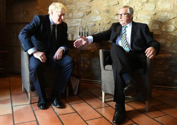 Prime Minister Boris Johnson with European Commission President Jean-Claude Juncker, inside Le Bouquet Garni restaurant in Luxembourg, prior to a working lunch on Brexit.