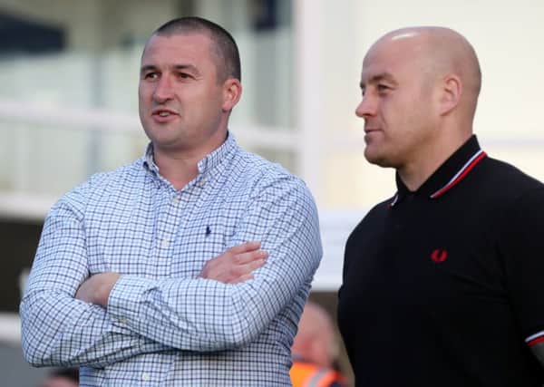 Key encounter: Victory for Wakefield coach Chris Chester, left, meant relegation for Danny Ward, right, and his Broncos.