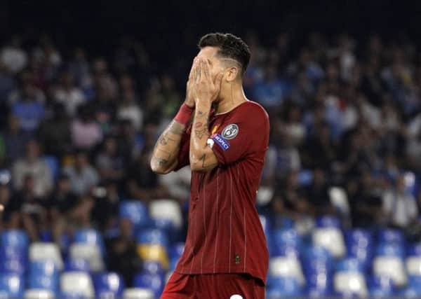 Liverpool's Roberto Firmino reacts during the Champions League Group E soccer match between Napoli and Liverpool, at the San Paolo stadium in Naples. (AP Photo/Gregorio Borgia)