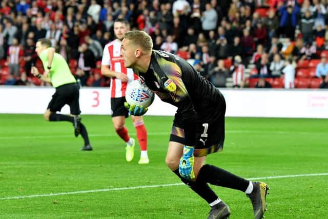 Daniel Iversen celebrates saving Sunderland's penalty (Picture: Frank Reid)