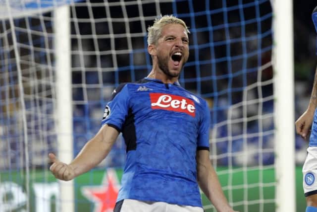 Napoli's Dries Mertens celebrates after scoring the opening goal of his team during the Champions League Group E soccer match between Napoli and Liverpool, at the San Paolo stadium in Naples. (AP Photo/Gregorio Borgia)