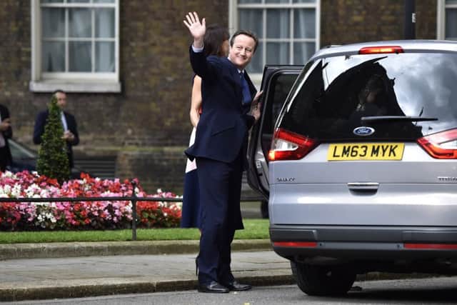 David Cameron waves to the crowds after leaving 10 Downing Street for the final time in July 2016.