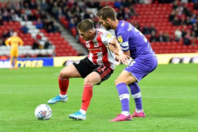 Rotherham's Joe Mattock challenges Lynden Gooch during Tuesday night's clash at the Stadium of Light. Picture: Frank Reid.