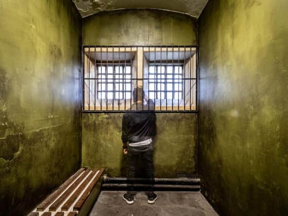 Volunteer Amarjit Singh in one of the prison cells
