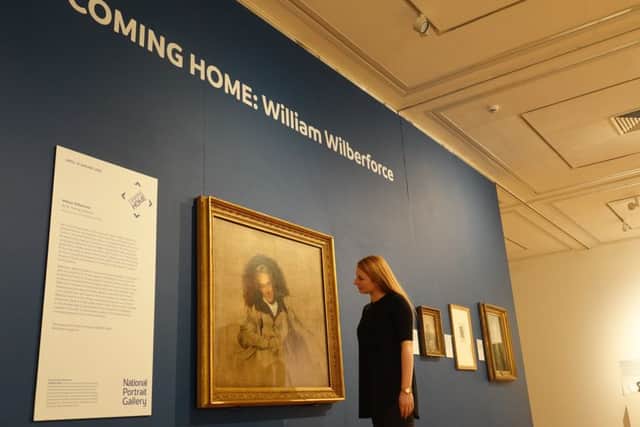 Stephanie Jones, exhibitions assistant at Ferens Art Gallery, with Sir Thomas Lawrences portrait of William Wilberforce.