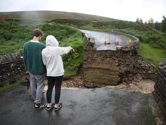 The collapsed bridge on Grinton moors following flash flooding in the Yorkshire Dales. Picture by SWNS.