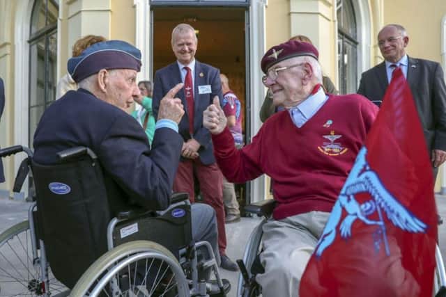 Former paratrooper Sandy Cortmann (right) from Aberdeen, talks to Canadian veteran Lloyd Bentley during an emotional return to Arnhem Picture: Steve Parsons/PA Wire
